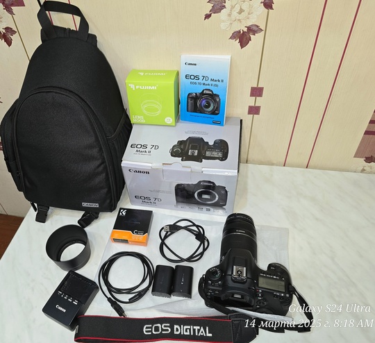 родам зеркальную камеру Canon EOS (1)